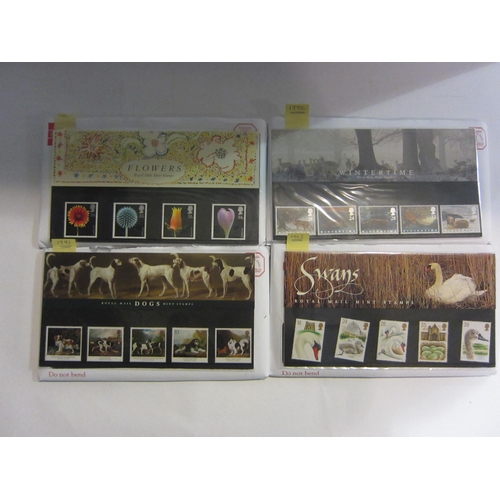 4399 - A collection of Royal Mail mint stamp presentation packs, over £115 of face value