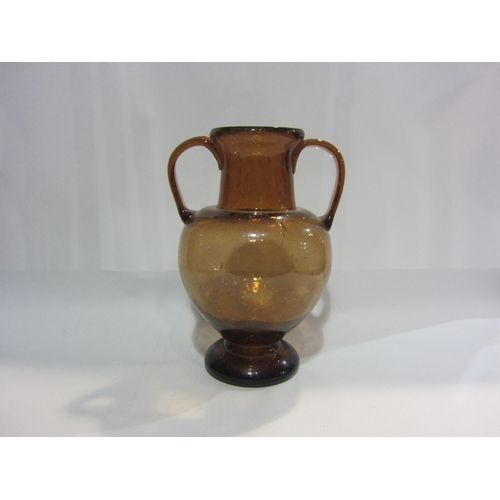 4404 - A Studio glass twin handled vase, 31cm tall