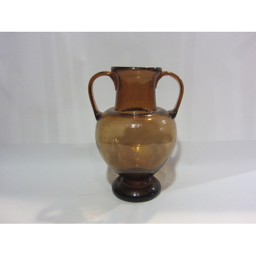 4404 - A Studio glass twin handled vase, 31cm tall