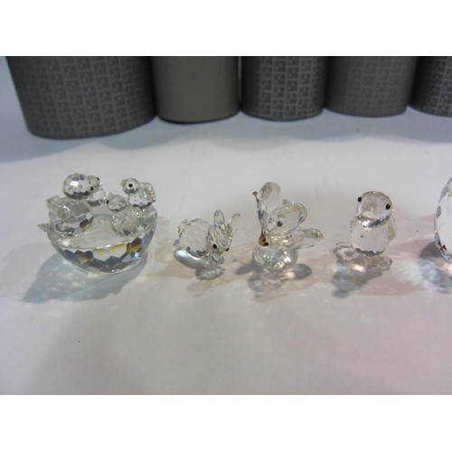 4414 - A collection of Swarovski crystal; owl, duck, small butterfly and rabbit, seal, bird's nest mother a... 