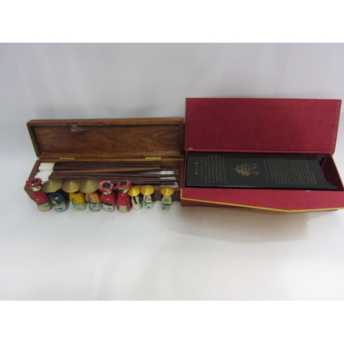 4437 - A collection of Oriental items; chopsticks in inlaid mother-of-pearl box, small screen, figures, etc