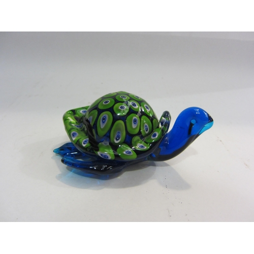 4443 - A mixed lot including Murano style turtle, two glass paperweights, two onyx eggs and a floral painte... 