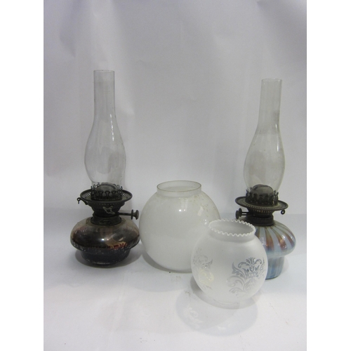 4445 - Two oil lamps with Griffin chimneys, one with a Vaseline base