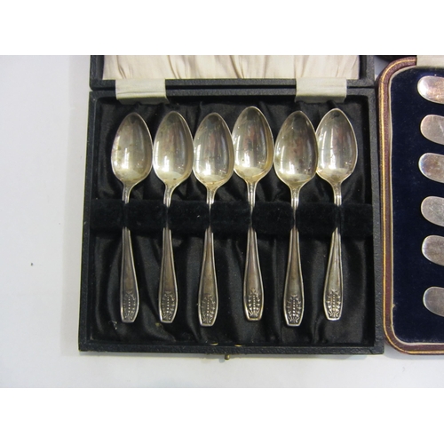 4453 - A set of silver handled butter knives with scroll handles together with a set of six silver teaspoon... 