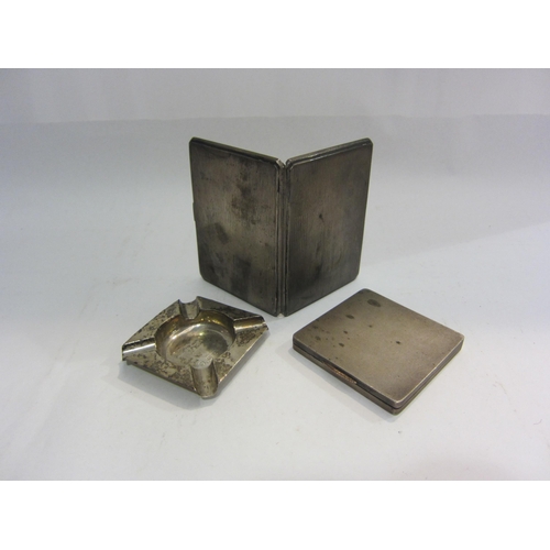 4458 - Two silver cigarette cases, each with gilded interiors, together with an ash tray (3)