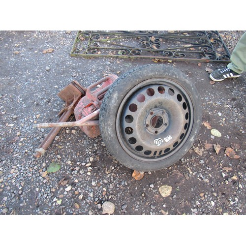 3238 - A bench vice, fuel can, trailer wheel with tyre and a watering can