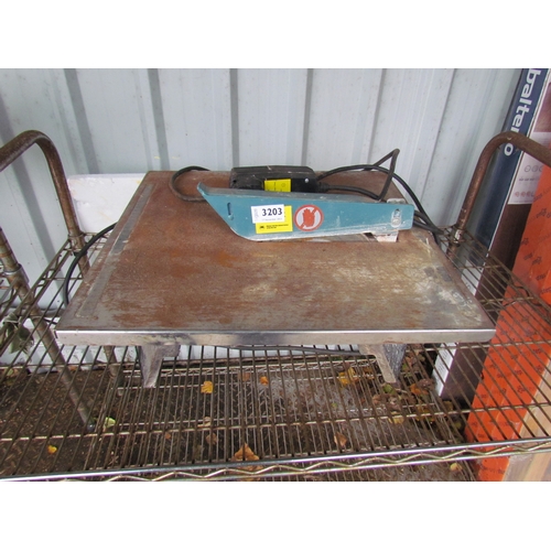 3203 - A tile cutter.  DTI FAILURE: Please see information pages