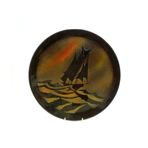 1135 - A Poole Pottery Aegean Charger depicting a sailing ship. 41.5cm diameter