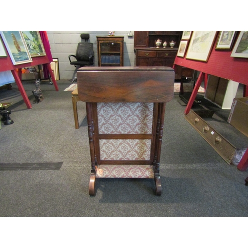 1143 - A Regency rosewood and tapestry prayer kneeler with turned supports, drop-flap table top, 74cm tall ... 