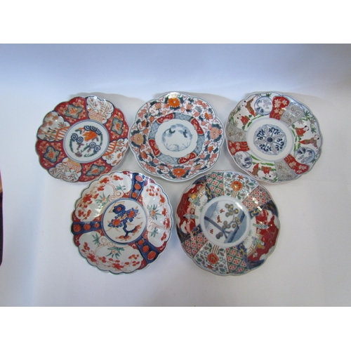 1243 - Five late 19th/early 20th Century Oriental Imari style plates painted with foliage and figures, (22c... 