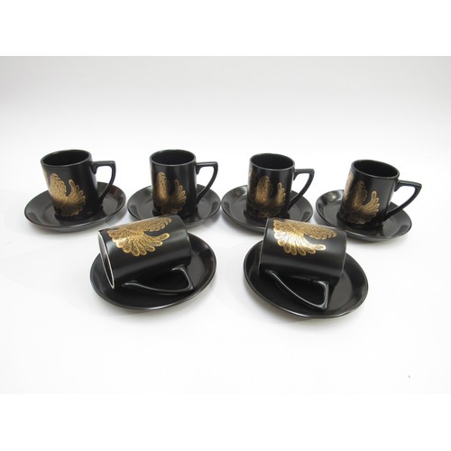 1321 - Portmeirion Pottery - A set of six coffee cups and saucers in the gold Phoenix pattern by John Cuffl... 