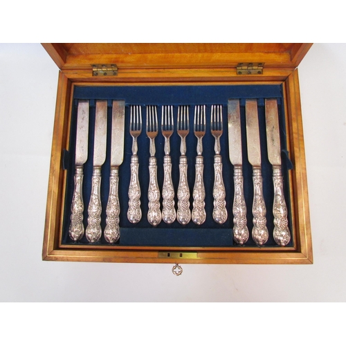 1344 - A canteen of silver handled twelve knives and forks, housed in an oak box with brass cartouche   (R)... 