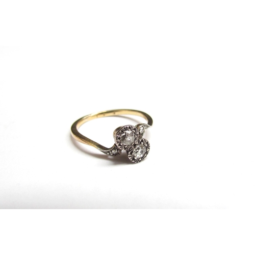 1387 - A late 19th Century old cut diamond cross over ring, unmarked. Size K, 1.9g  (R)  £70