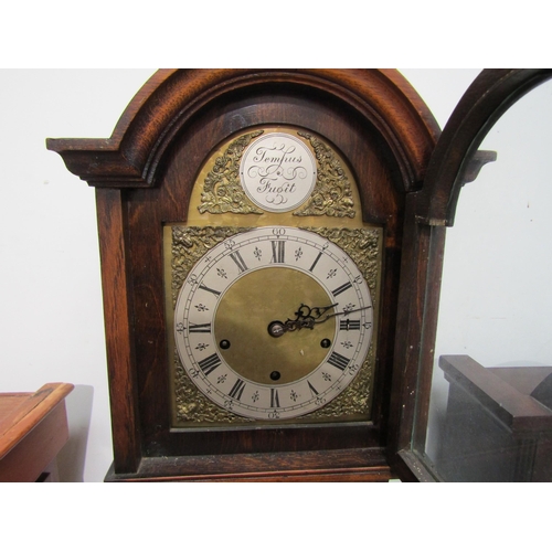 8011 - An oak cased Westminster chime Grandmother clock with brass face, Roman numerated dial and outer sec... 