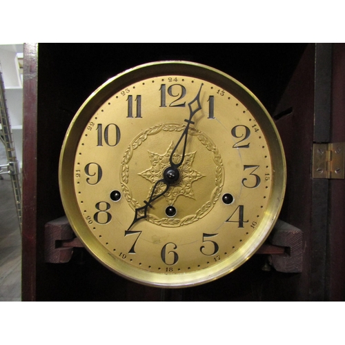 8016 - A mid 20th century mahogany wall clock with key and pendulum, 79cm tall x 32cm
