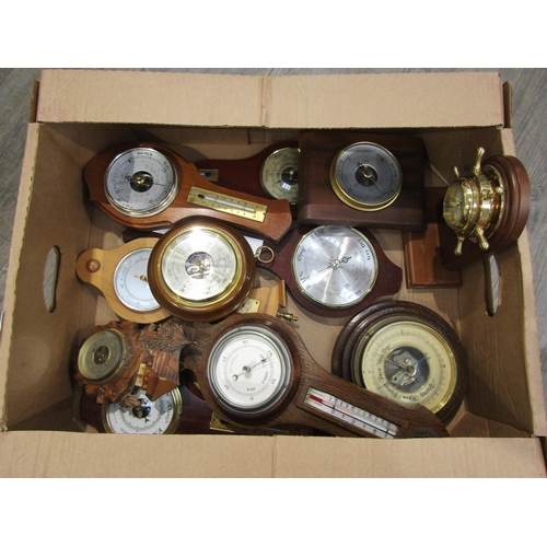 8024 - A box containing assorted barometers, mostly modern wall examples (11)