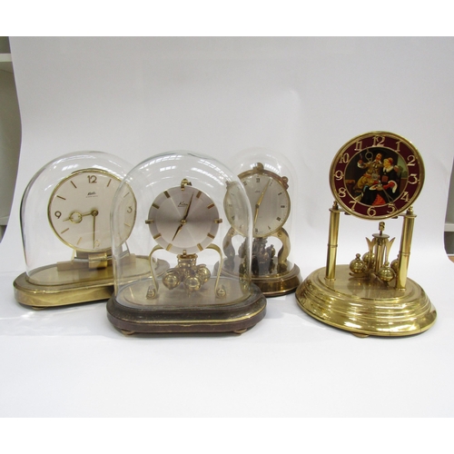 8025 - Four assorted anniversary clocks including Kundo electronic and Schatz, one lacking dome