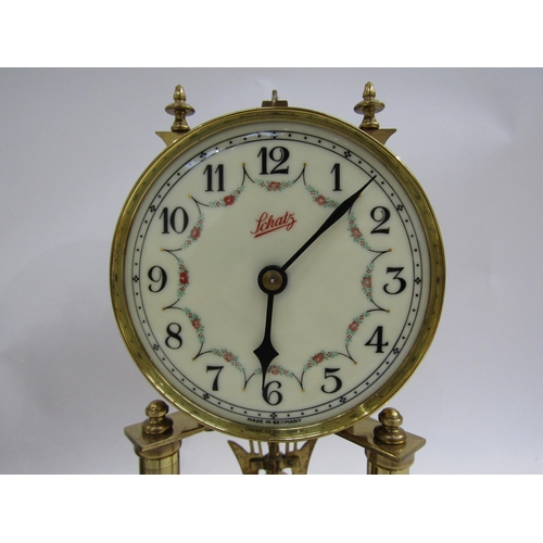 8038 - A pair of brass Schatz anniversary clocks, one under plastic dome. Both with white enamel dial with ... 