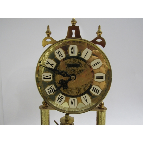 8042 - A brass Haller anniversary clock and brass Hermle Skeleton clock, under plastic and glass domes. Hal... 