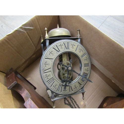 8046 - Two brass lantern clocks, one marked Elliot London. Both with engaged face, Roman numerals and pierc... 