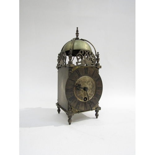 8048 - A brass lantern clock marked Coventry Astral, made in England, engraved dial with Roman numerals and... 