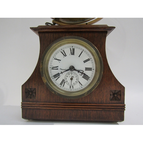 8053 - A Thwaites of London desk clock with mechanical atlas globe, 41.5cm tall