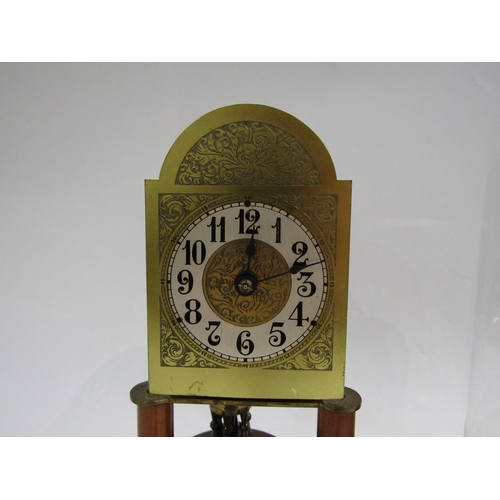 8054 - Two ornate anniversary clocks under glass domes - one with ornately engraved arch face, Arabic numer... 