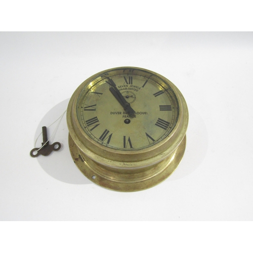 8063 - A brass bulkhead clock by Duver Drey Bloouel, France, seven-jewel unadjusted movement, brass dial wi... 