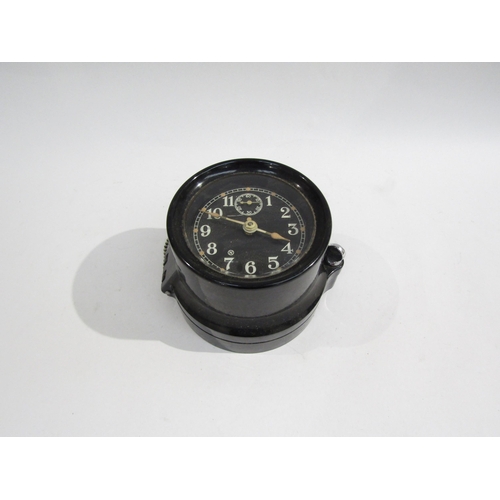 8065 - A WWII US navy mark I-boat clock, 1941, housed in bakelite case, No. 10668. No key. 9cm diameter dia... 