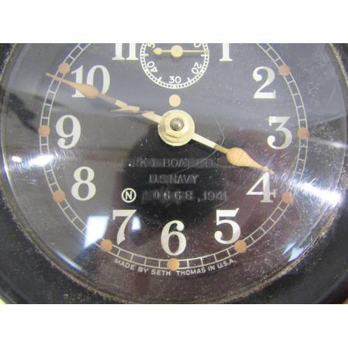 8065 - A WWII US navy mark I-boat clock, 1941, housed in bakelite case, No. 10668. No key. 9cm diameter dia... 