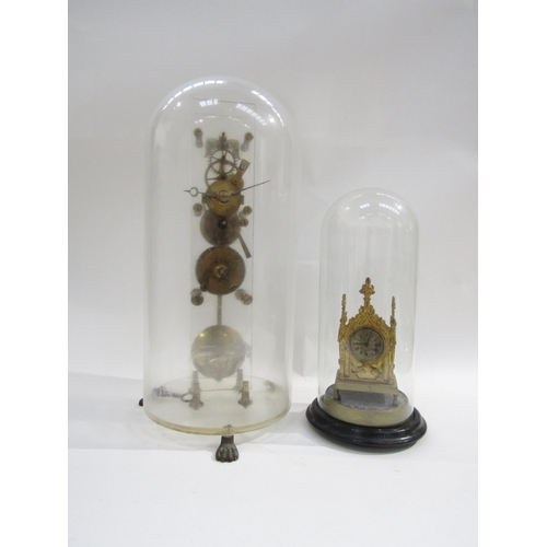 8074A - A skeleton clock under glass dome, single fusee, together with a Cathedral style timepiece under gla... 