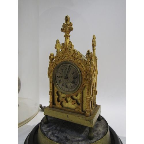 8074A - A skeleton clock under glass dome, single fusee, together with a Cathedral style timepiece under gla... 