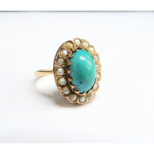 1389 - A gold turquoise and seed pearl ring, the central oval cabochon turquoise framed by seed pearls, sta... 