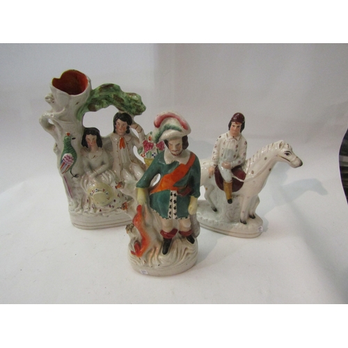 1482 - Three Victorian Staffordshire figures, horse and jockey, couple under bower (a/f) and huntsman