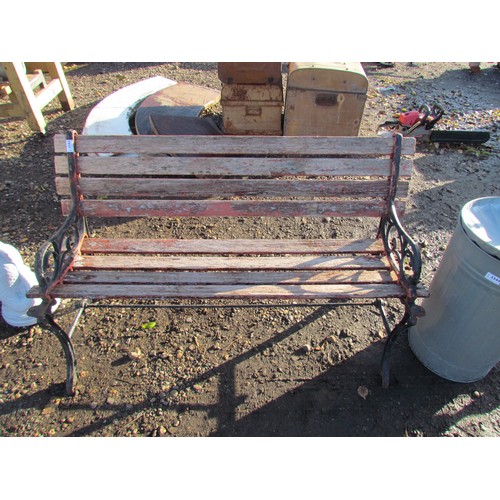 3343 - A cast ended timber slatted garden bench, a/f