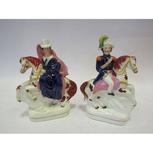 1443 - A pair of Victorian Staffordshire figures of Victoria and Albert on horseback, a/f 16.5cm tall