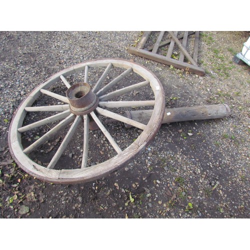 3358 - An iron rim wooden cart wheel with a timber axle