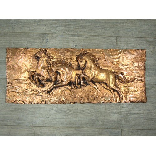 1182 - A mid century 'bronzed' painted wall plaque depicting three horses. Unmarked. 23cm x 58cm