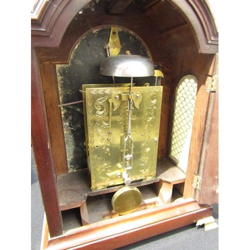 8068 - A Georgian mahogany bracket clock, Baker Tamworth, with arch white dial and Roman numerals, also out... 