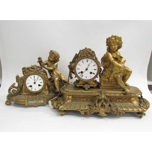 8070 - A French ornate gilt metal clock with cherub holding lamb on plinth base, enamel Roman numeral dial,... 