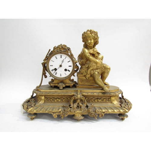 8070 - A French ornate gilt metal clock with cherub holding lamb on plinth base, enamel Roman numeral dial,... 