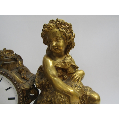 8070 - A French ornate gilt metal clock with cherub holding lamb on plinth base, enamel Roman numeral dial,... 