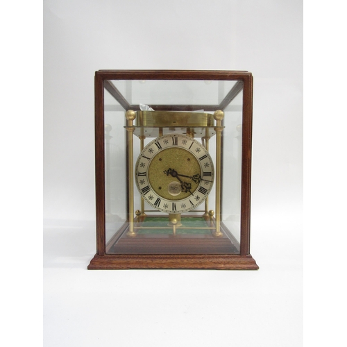 8076 - A Thwaites & Reed rolling ball clock, the open movement with silvered dial and named plaque with fou... 