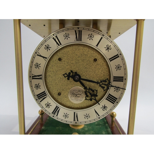 8076 - A Thwaites & Reed rolling ball clock, the open movement with silvered dial and named plaque with fou... 