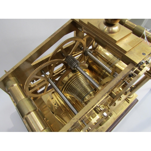 8077 - A Congreve Rolling Ball brass clock with our column frame and central zigzag track for the ball, an ... 