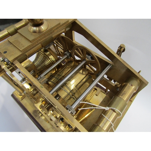 8077 - A Congreve Rolling Ball brass clock with our column frame and central zigzag track for the ball, an ... 