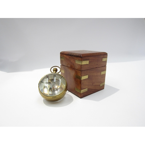 8089 - A magnifying spherical paperweight clock with visible movement from both sides, held with brass, Rom... 