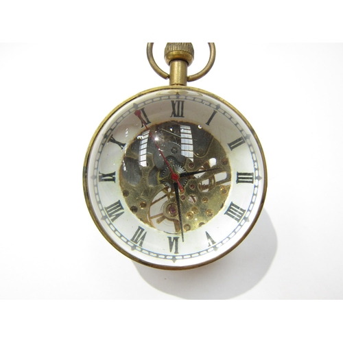 8089 - A magnifying spherical paperweight clock with visible movement from both sides, held with brass, Rom... 