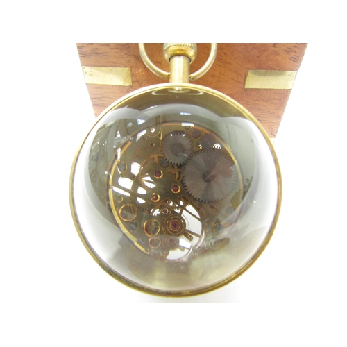 8089 - A magnifying spherical paperweight clock with visible movement from both sides, held with brass, Rom... 