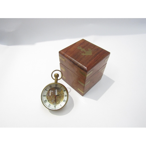 8089 - A magnifying spherical paperweight clock with visible movement from both sides, held with brass, Rom... 